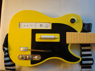 Illustration for article titled Nyko Gaming Goodness: Guitar Hero / Rock Band Guitar, Wireless Nunchuck, PS3 Rumble and More